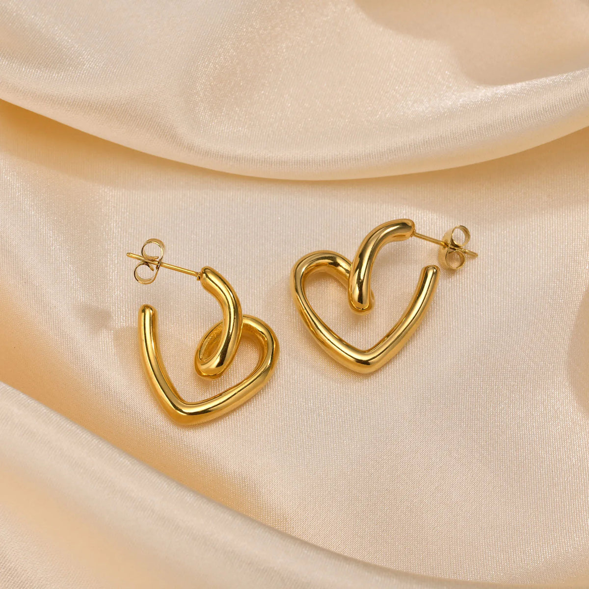 Gold-plated heart hoop earrings, sculpted curved shape with posts