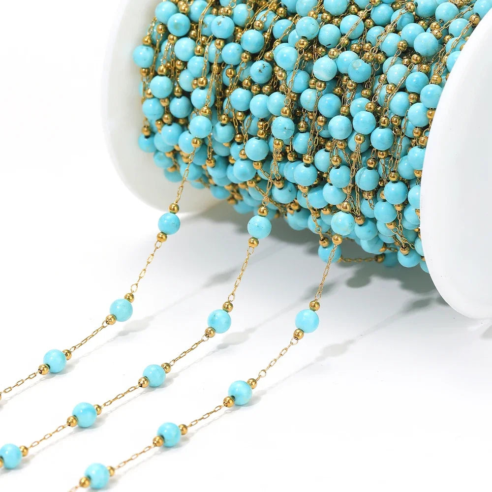 Stainless steel bead chain with gold-tone links and light blue bead drops for DIY jewelry