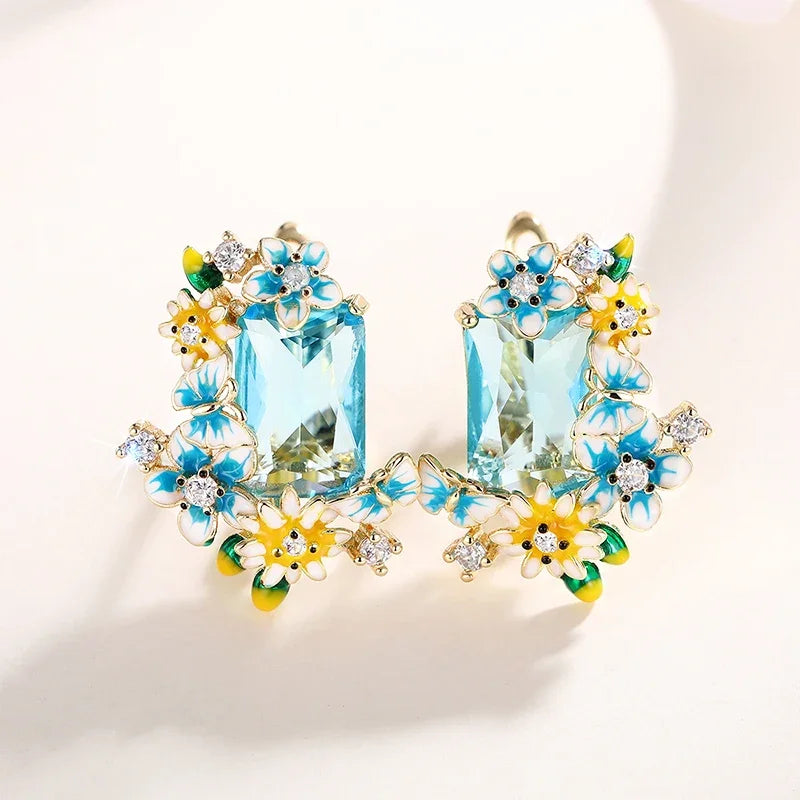 Gold-tone floral drop earrings with large aqua crystal drops and colorful enamel flowers
