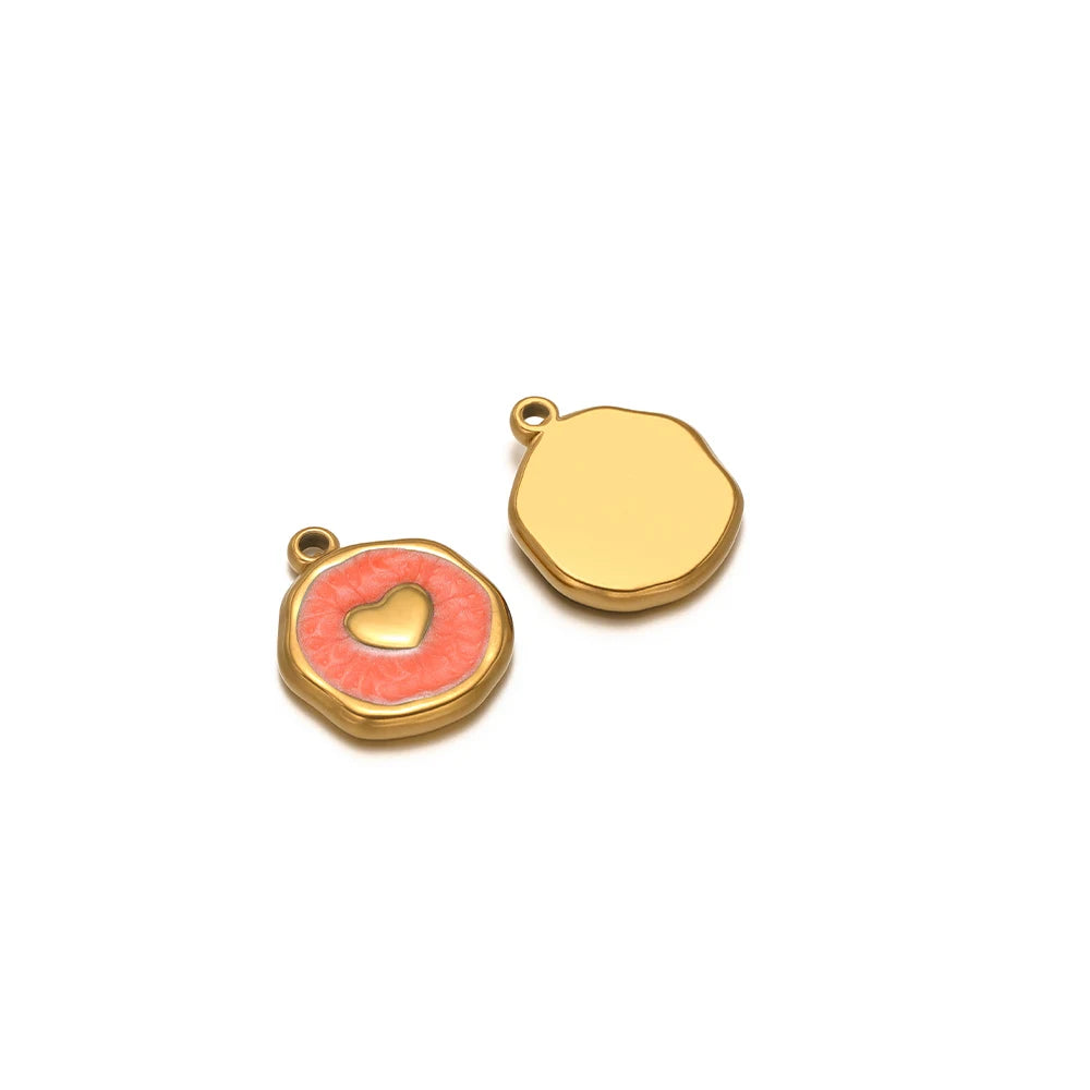 Enamel heart charm pendant with red enamel and gold heart on round gold bezel