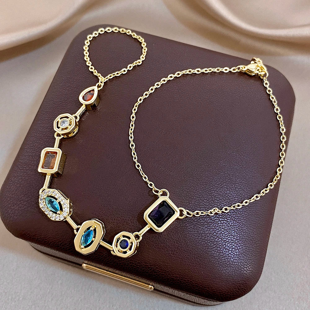 Gold-tone geometric zircon bracelet with square links and blue, green, red, and white stones