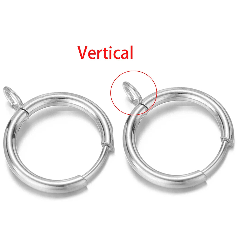 Silver-tone huggie hoops showing vertical loop post placement on the ring.