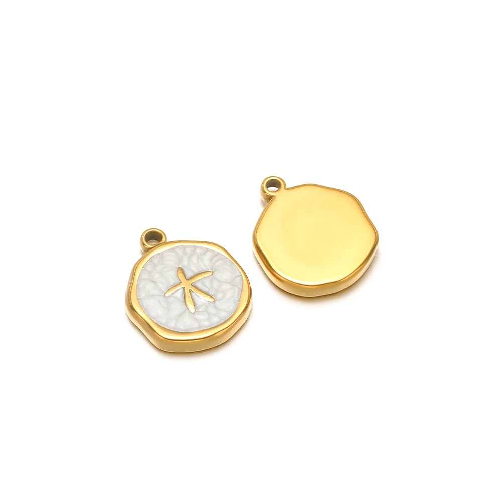 Enamel shell charm pendants, one light gray with gold fish design and one yellow plain cap