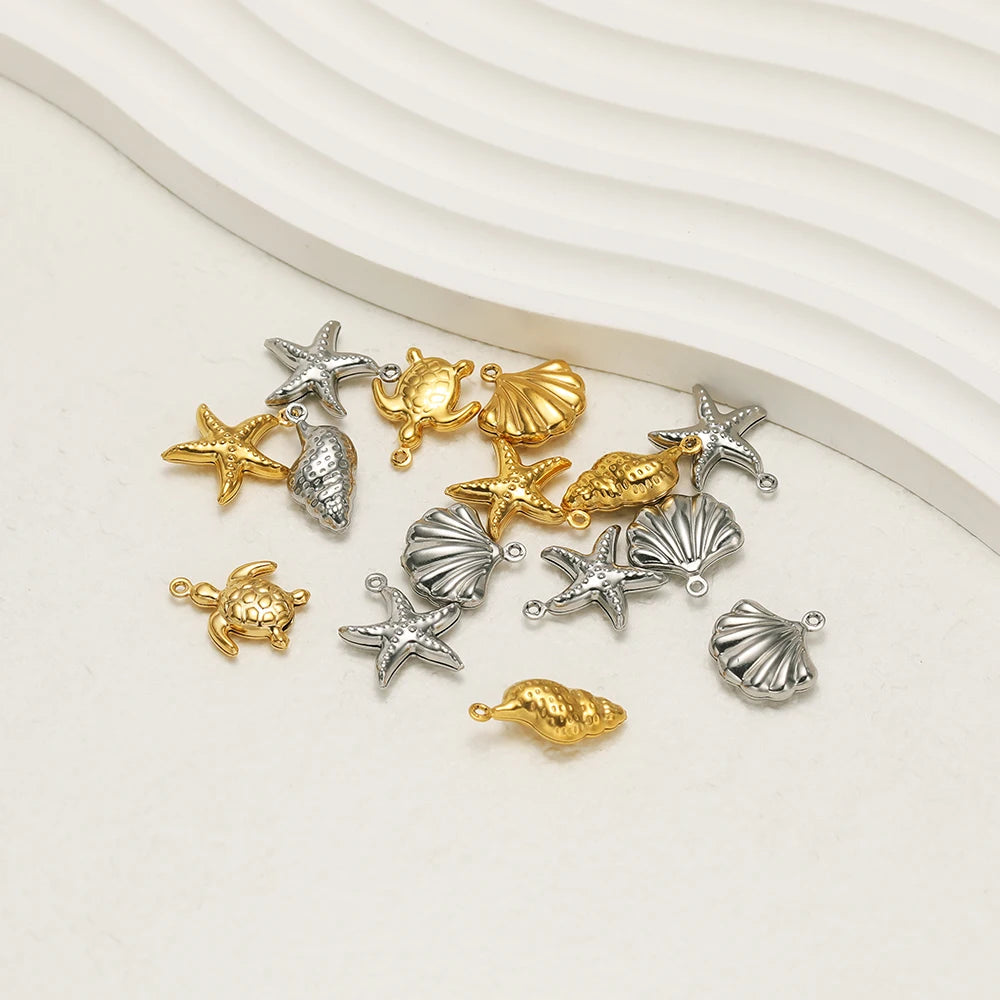 Flat sea charms with hanging loops: starfish, shells, turtle, and conch in gold and silver