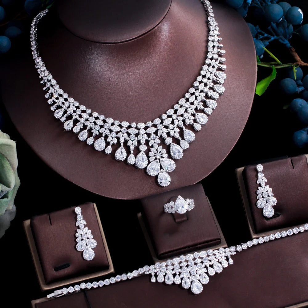 Rhinestone necklace set with earrings, ring, and bracelet arranged for viewing