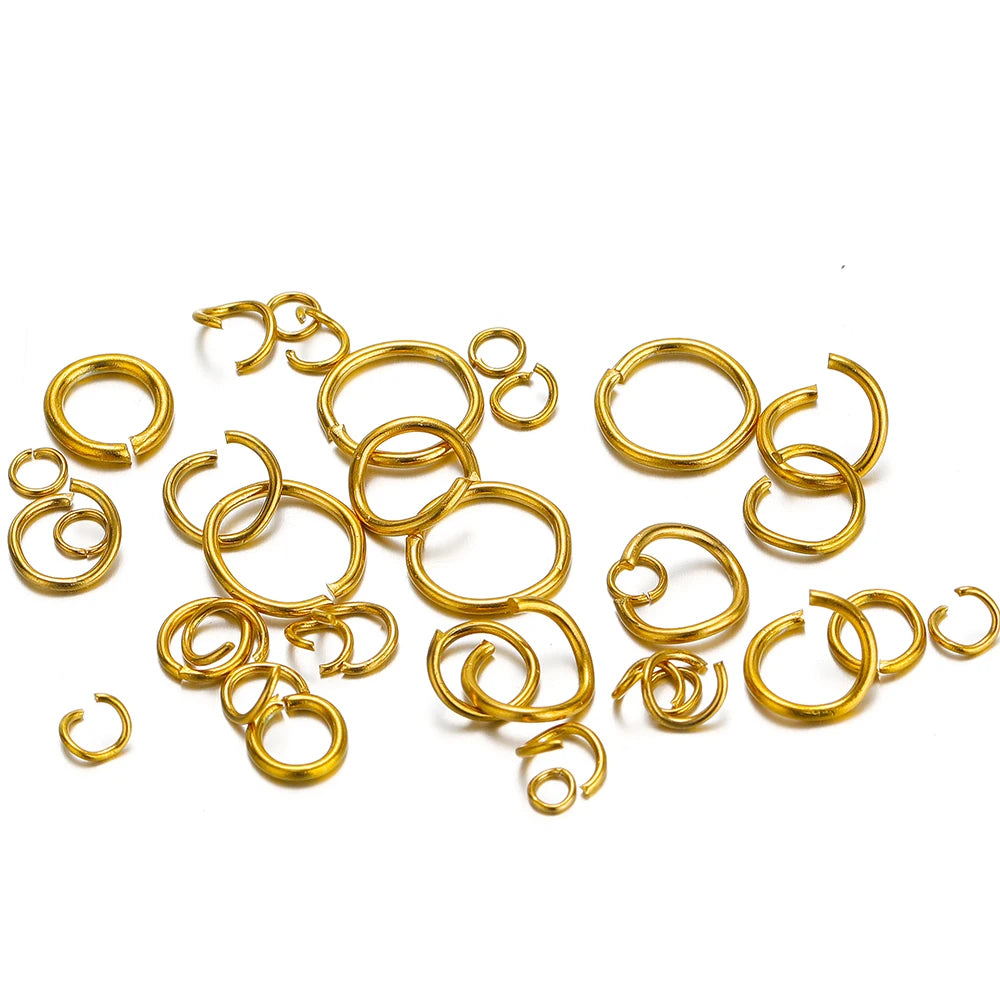 Gold-colored jump rings and split rings assortment, mixed sizes in a heap