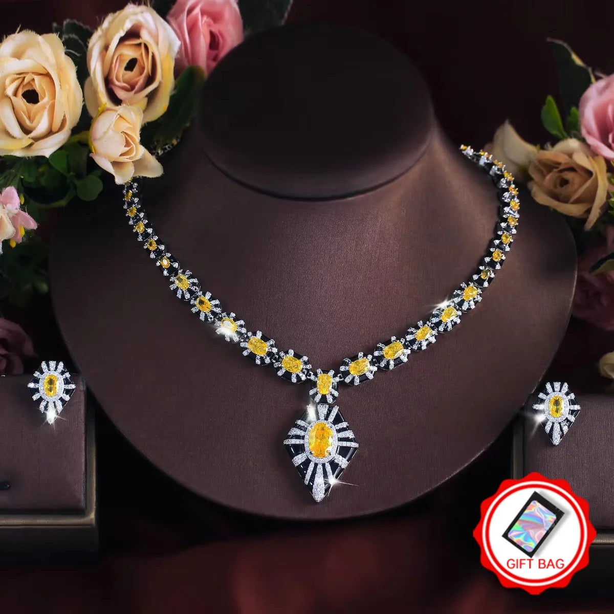 Yellow zircon and black enamel necklace and earrings, with a geometric drop pendant.