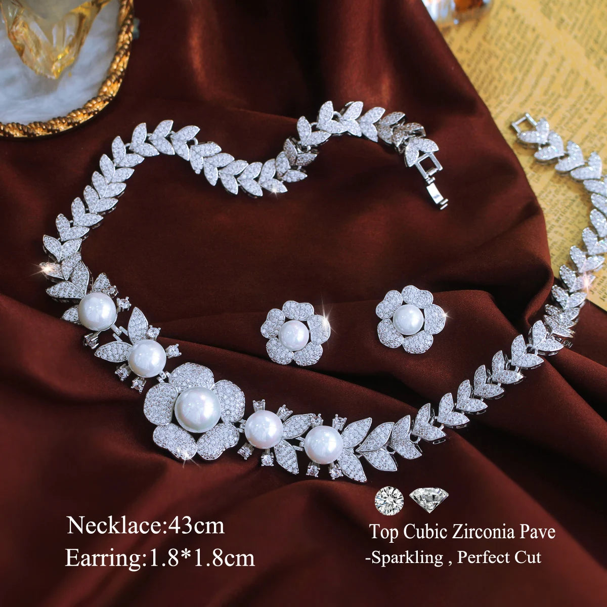 Cubic zirconia and pearl necklace with matching flower stud earrings