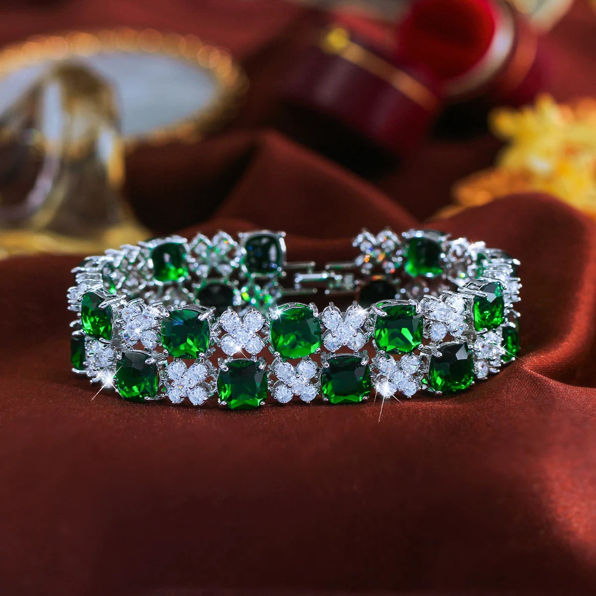 Green and clear cubic zirconia flower tennis bracelet with a silver-tone setting