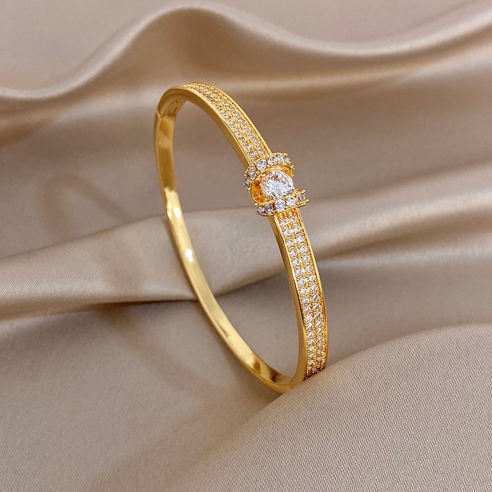 Gold rhinestone cuff bracelet with star-shaped center detail
