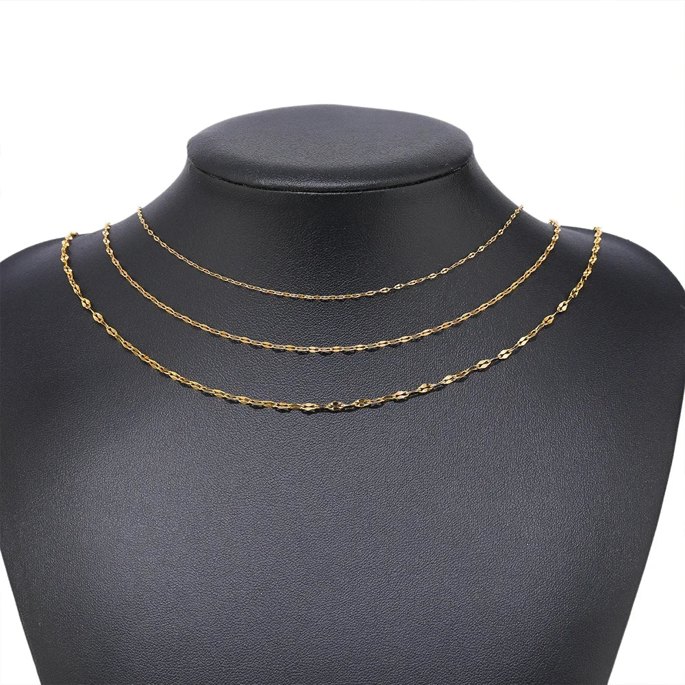 Gold flat oval cable chain necklace on black display bust