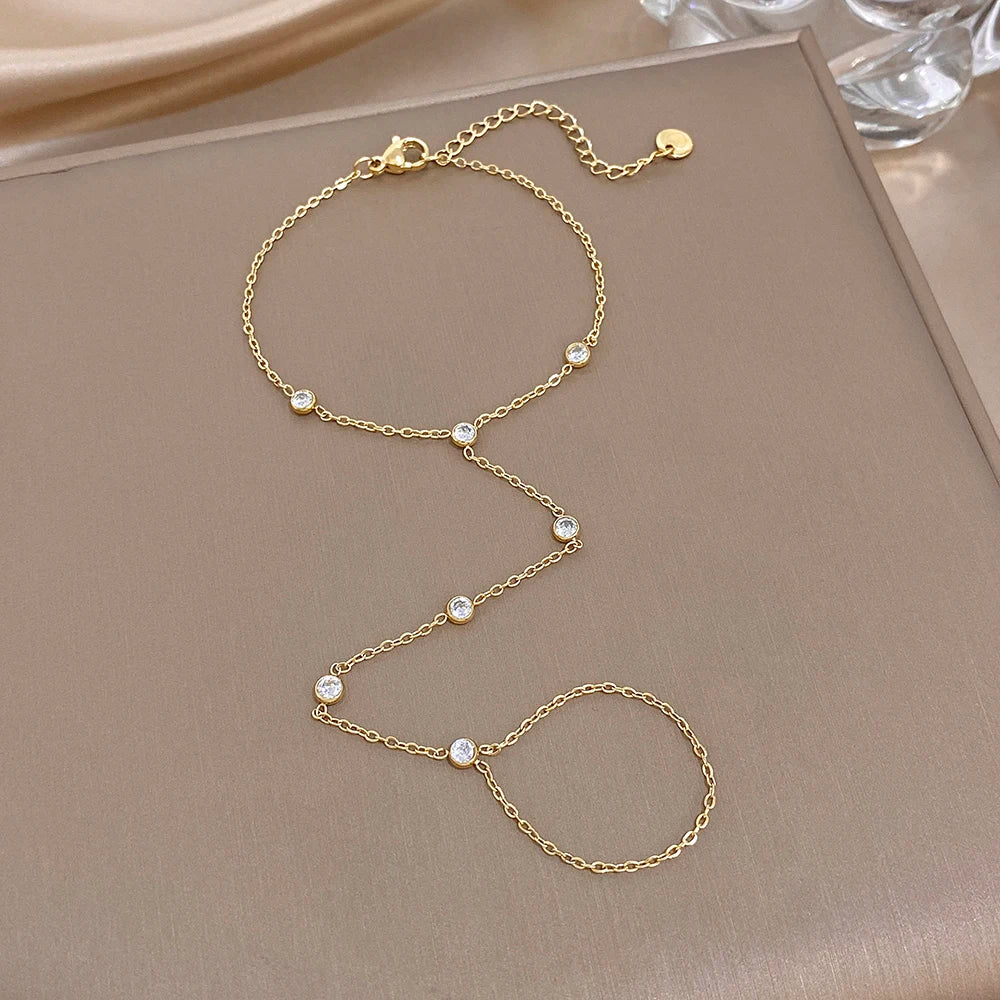 Gold zircon bead link bracelet set with small round stones on chain and ring