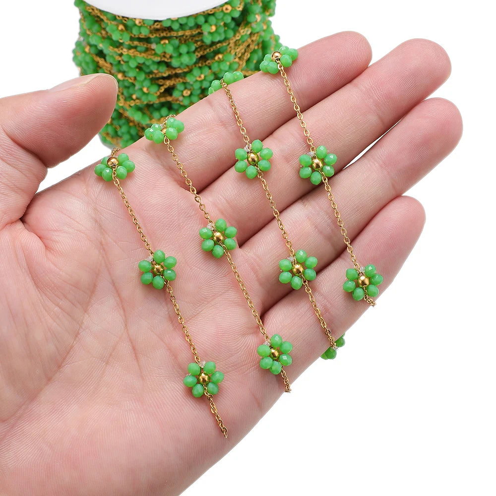 Gold-tone stainless steel daisy flower beaded satellite chain with green beads