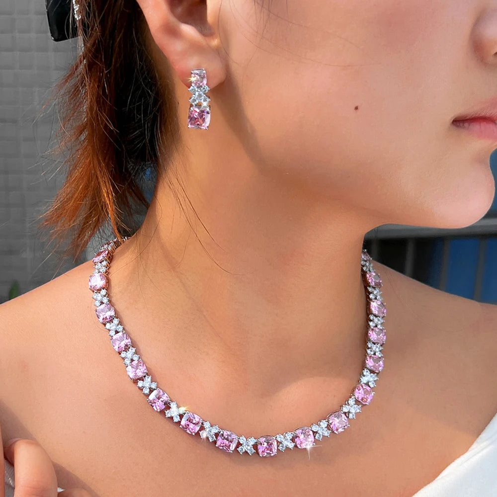 Pink square zirconia choker necklace with matching square drop earrings on model