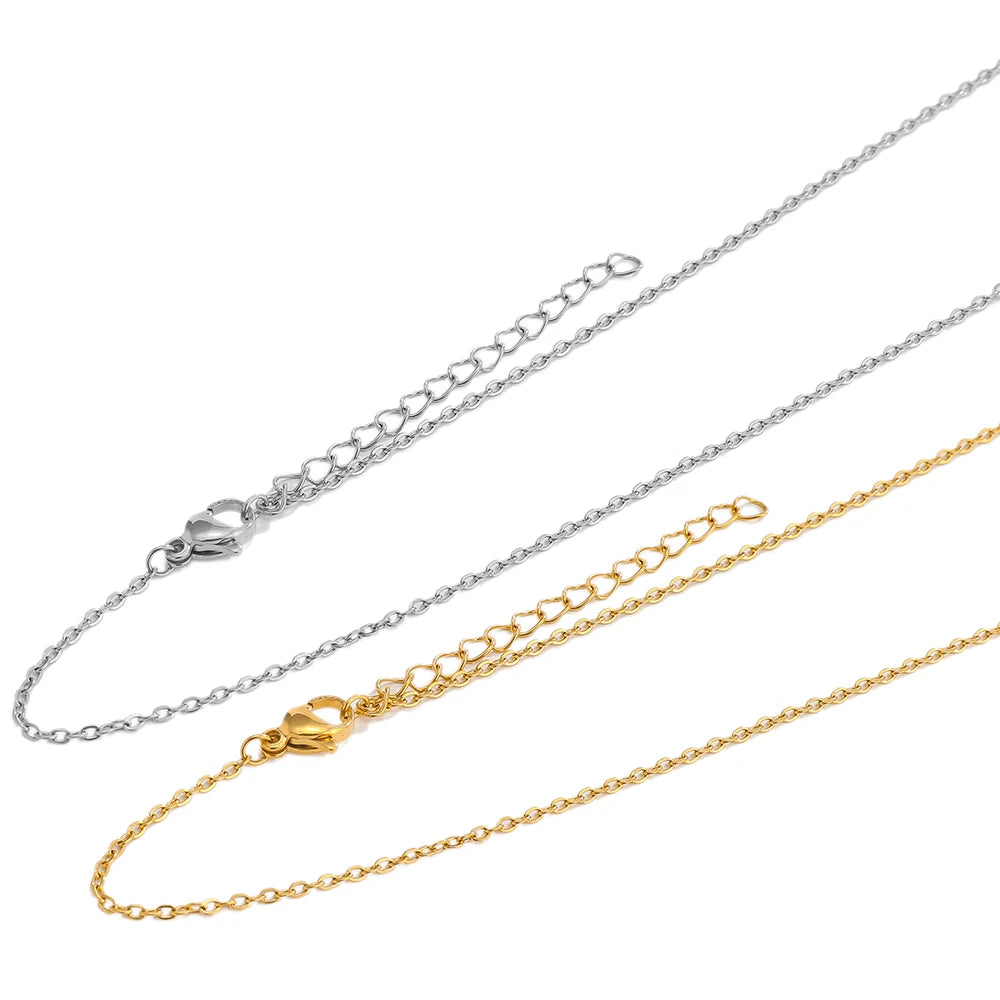 Cable link chain extenders in steel and gold tones, with clasp connector ends