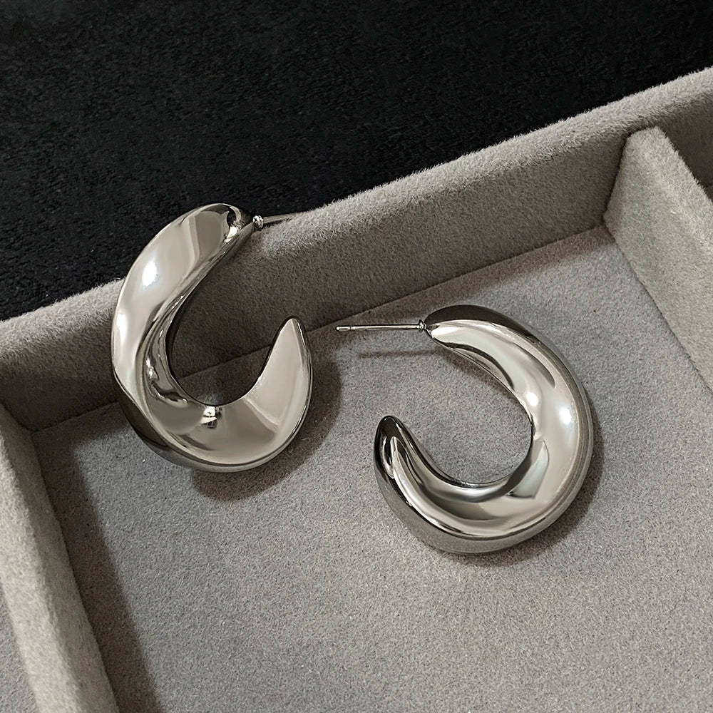 Pair of silver-tone glossy crescent hoop earrings with post backs