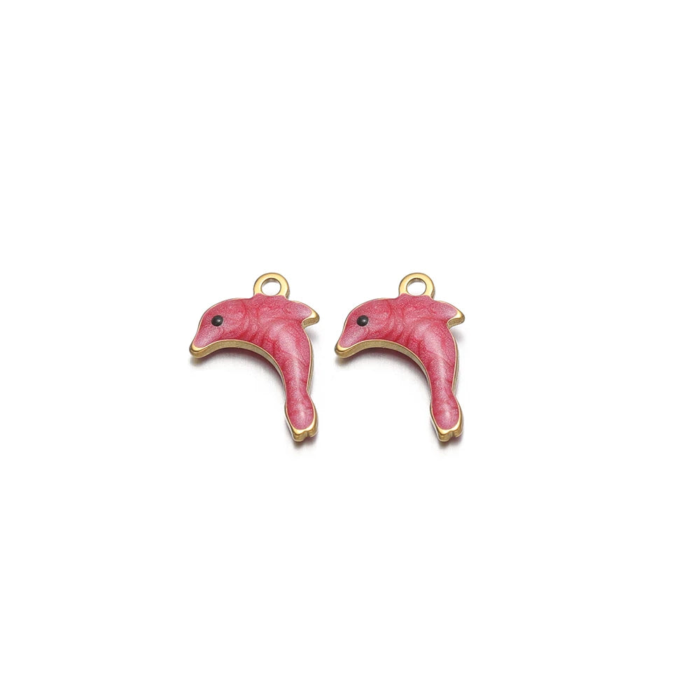 Two pink enamel dolphin charms with gold-tone loops
