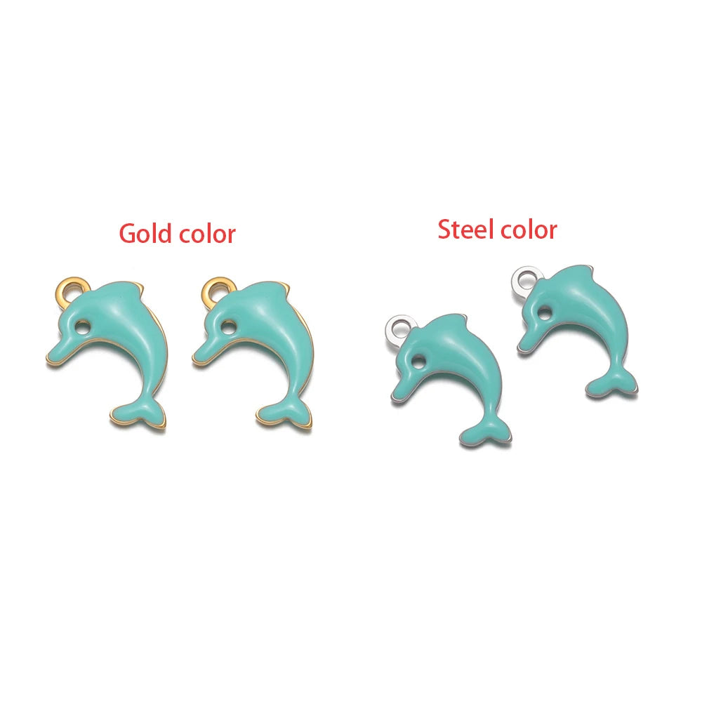 Light blue dolphin-shaped charm set with loop, gold-tone and silver-tone finishes.