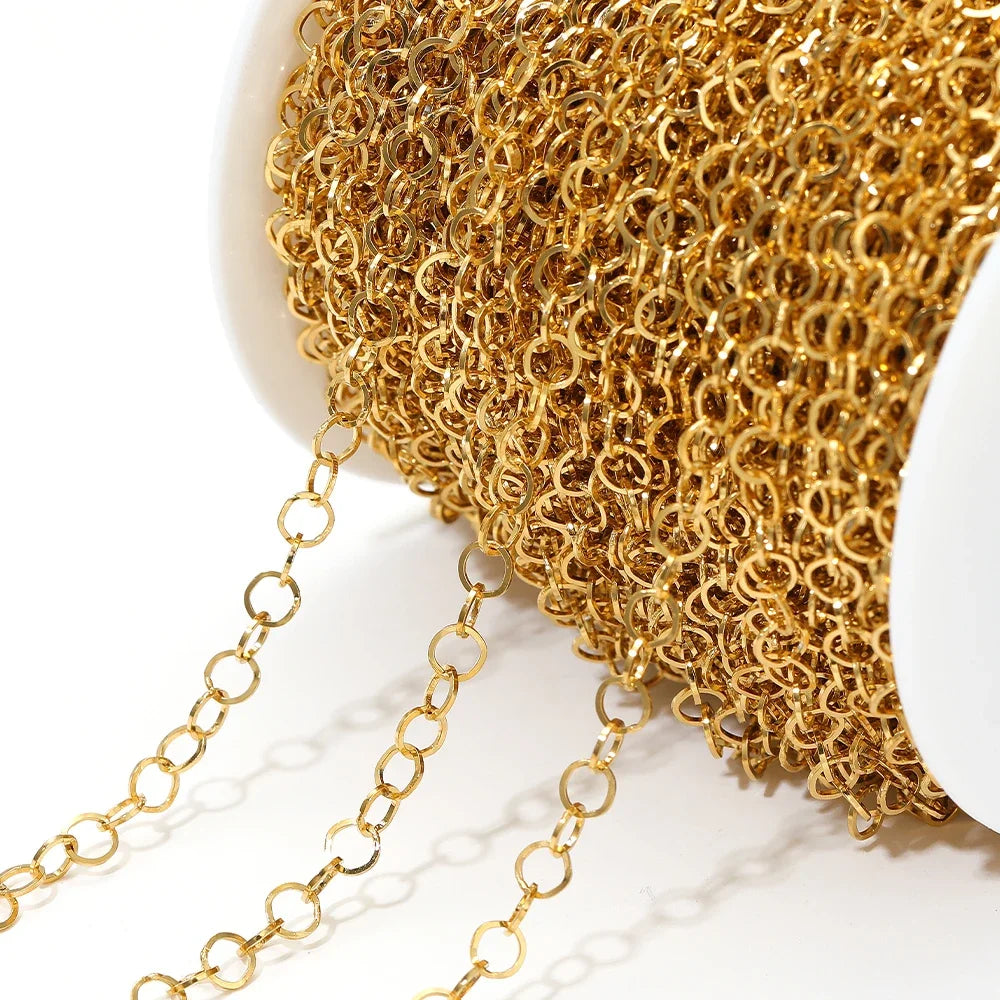 Gold o-ring chain roll with hanging loop links, close-up