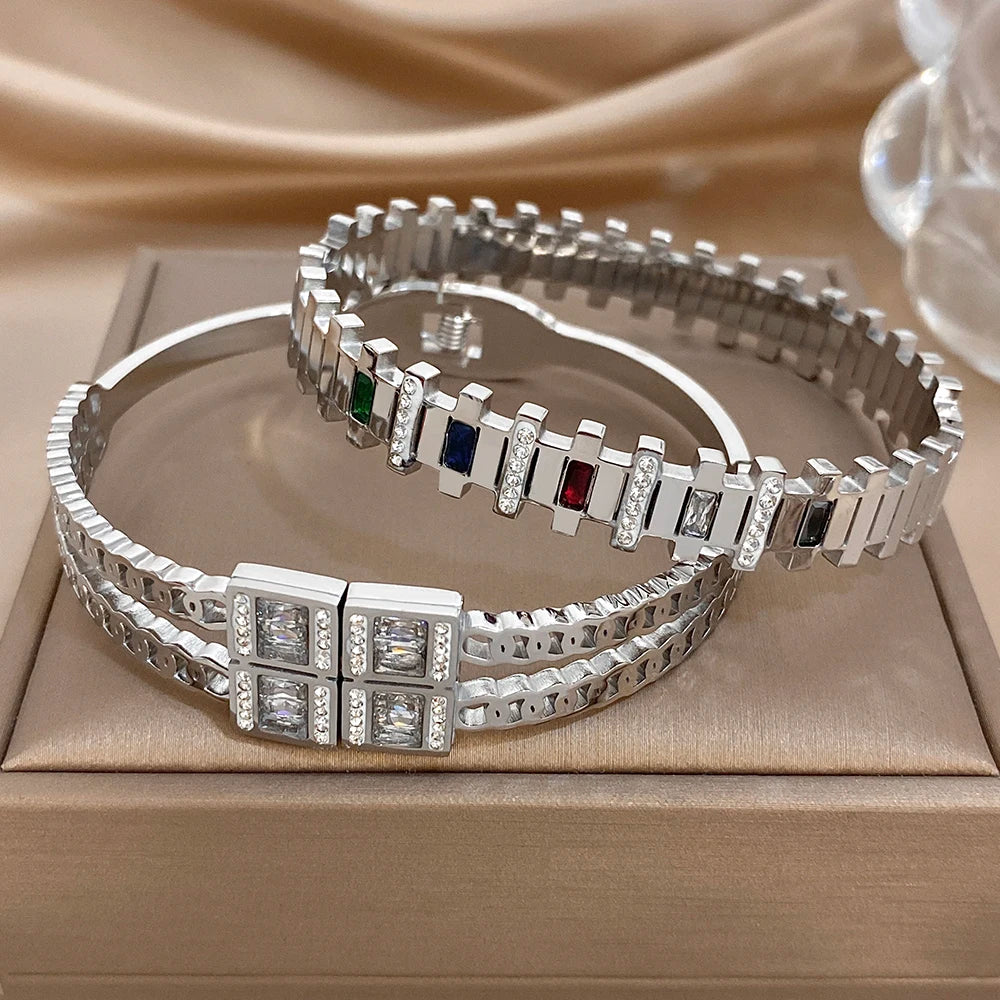 Silver-toned bangle bracelet set with square clear zircon and small colored stone inlays