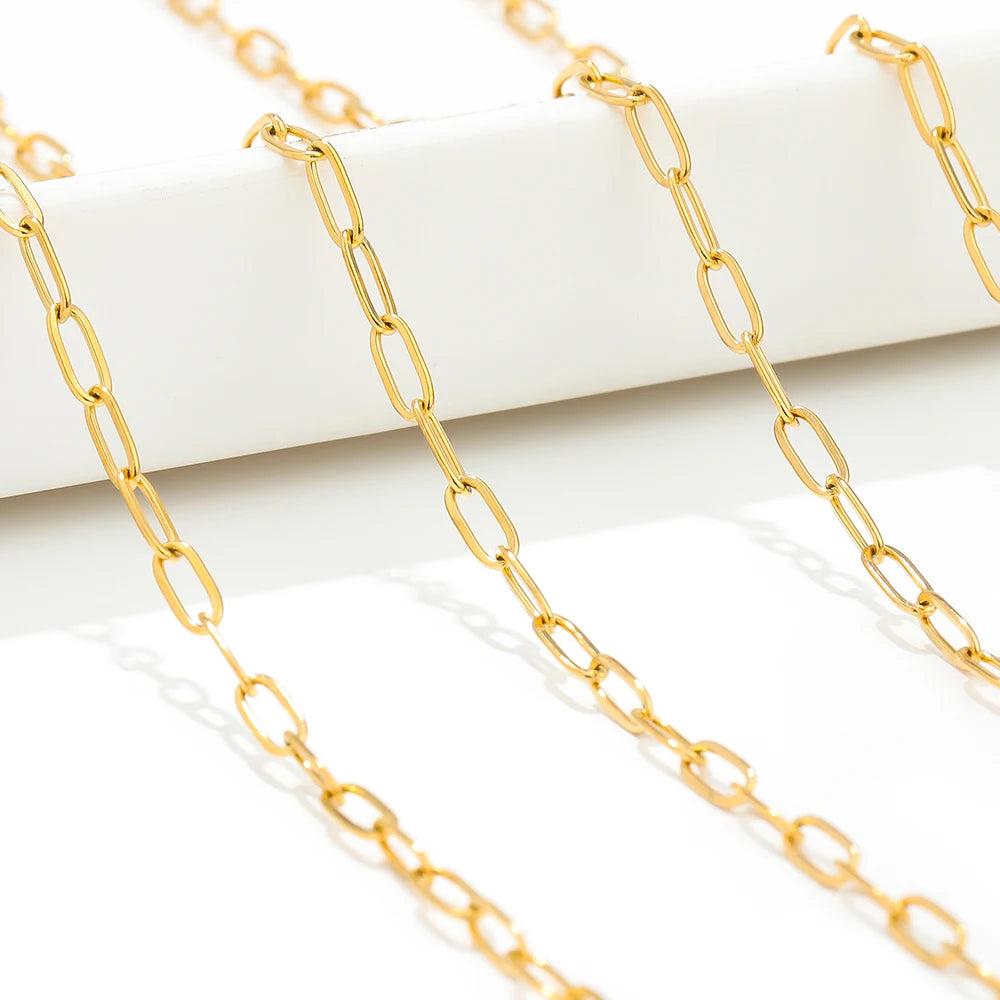 Gold-tone flat link chain, smooth oval links stretched in a row