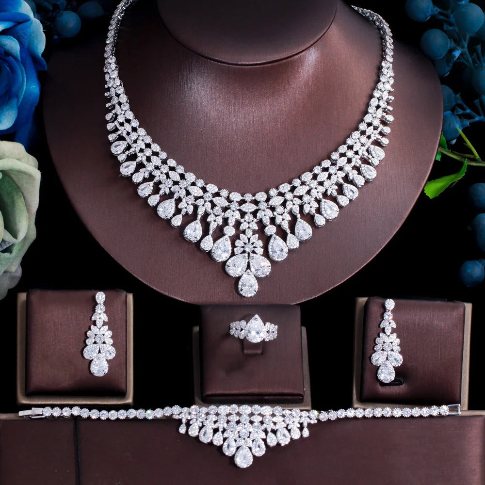 Seven-piece bridal jewelry set on display: necklace, ring, and earrings with yellow crystal drops