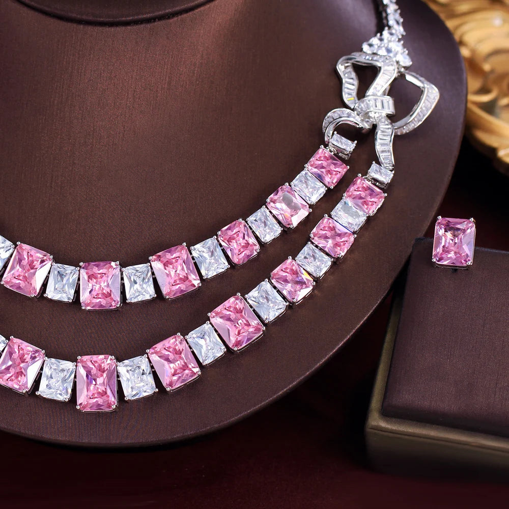 Close-up of pink and clear square stones on a double-layer necklace set