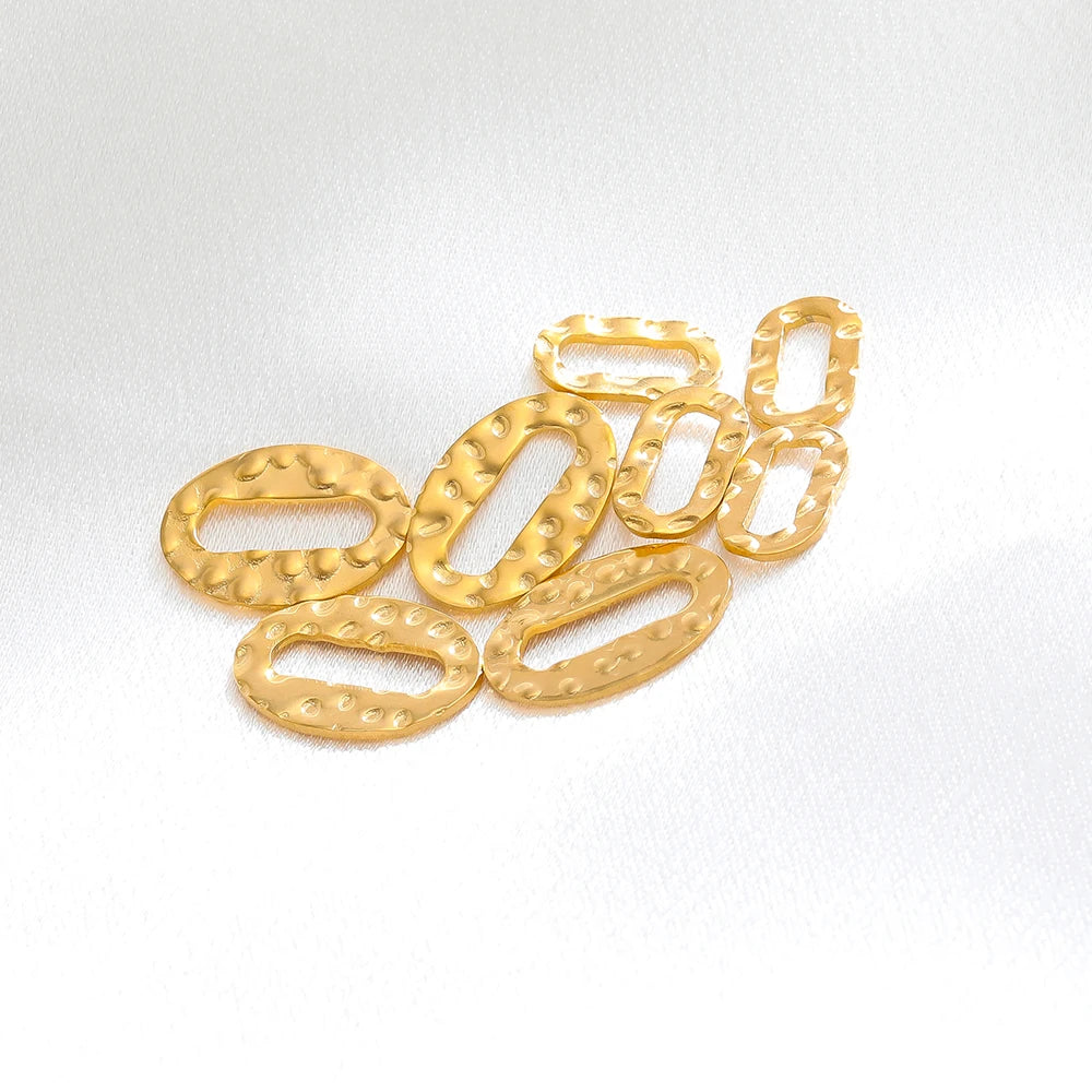 Gold hollow oval earring charm connectors with raised dots, small hoop-like opening