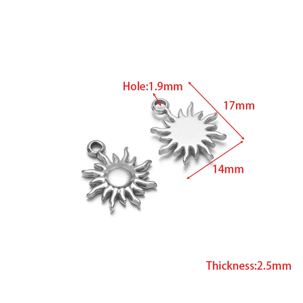 Silver sunburst and circular sun-shaped pendant charms with loop bails