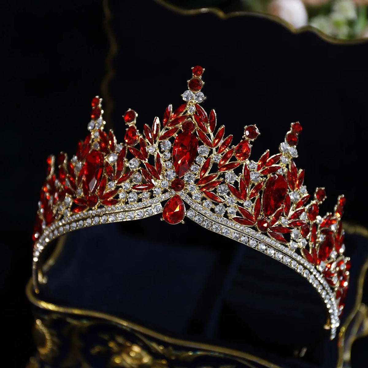 Crystal pageant tiara with red gemstones, silver-tone setting, and rhinestone band