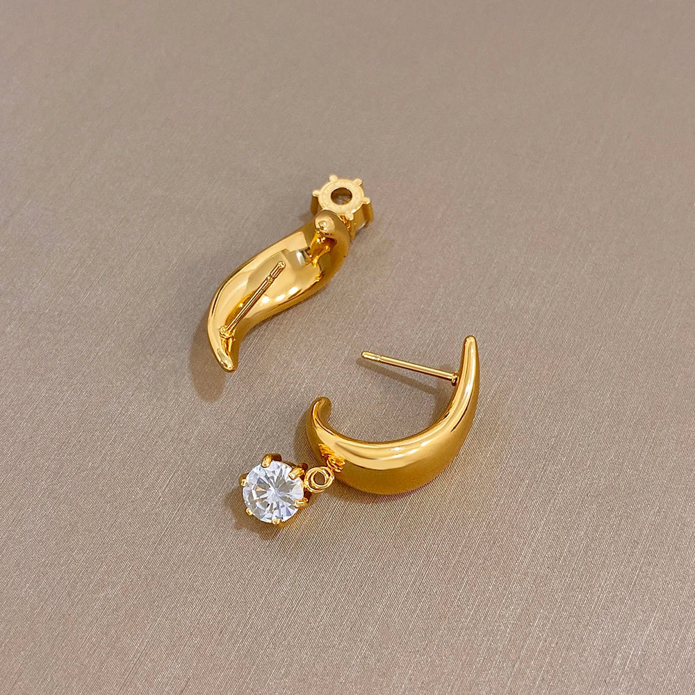 Gold-tone half-hoop stud earrings with dangling clear round crystals