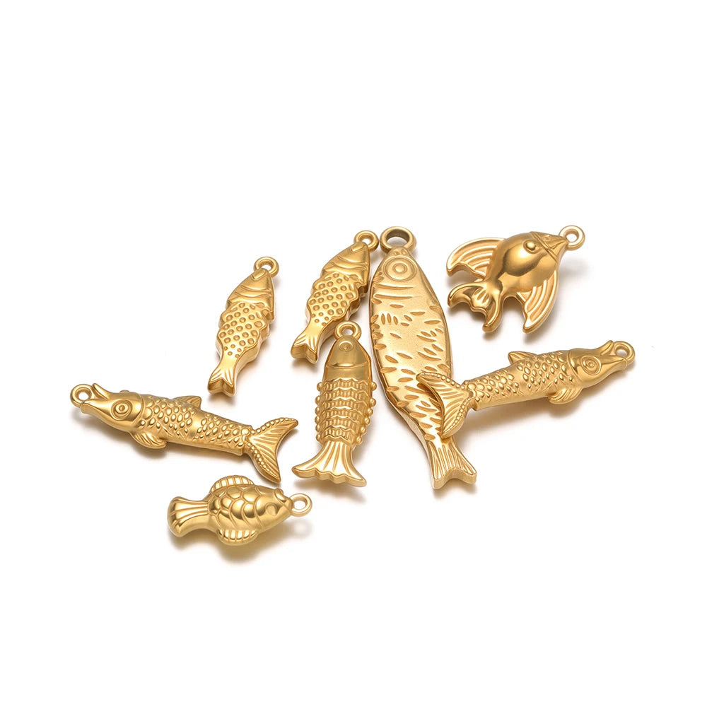 Gold-tone 3D fish charm set with five solid fish pendants and hanging loops