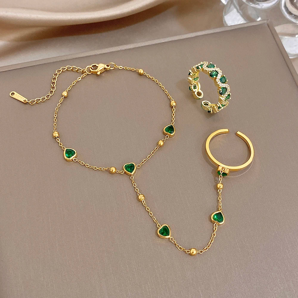 Gold-plated chain bracelet with green heart beads with ring and cuff ring pieces
