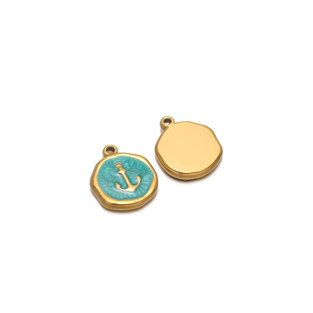 Gold-tone round charm with teal anchor enamel, plus blank gold-tone round charm