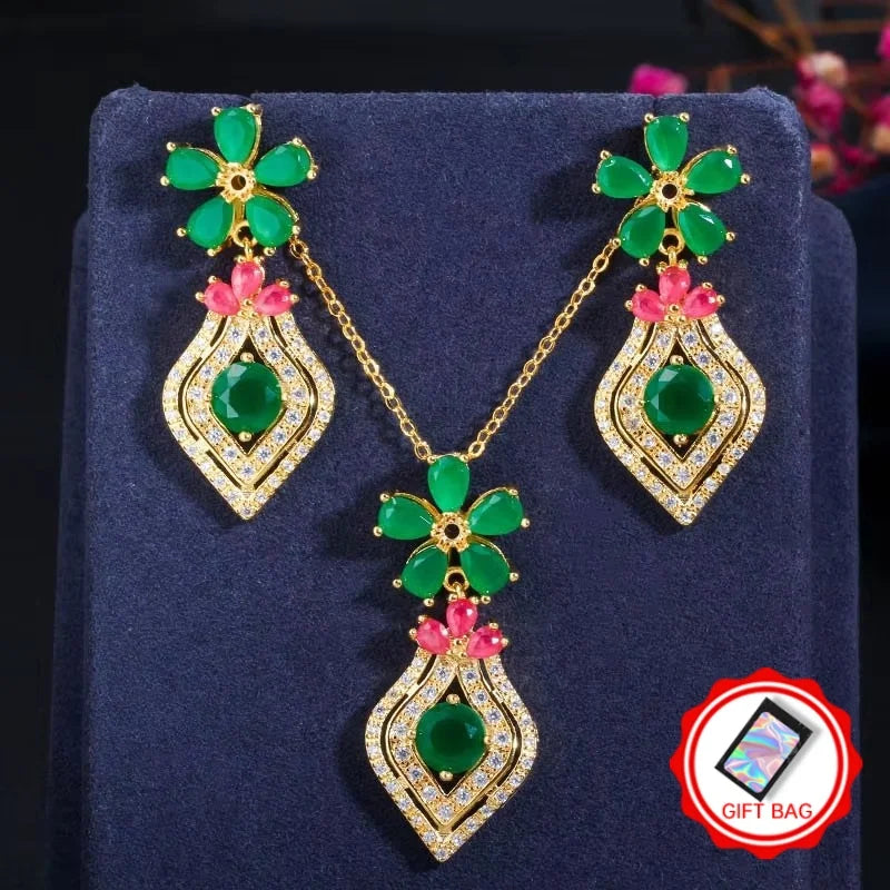 Gold-tone necklace and drop earrings with green and pink stones and crystal detailing