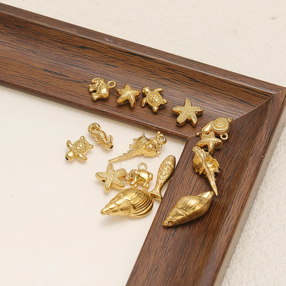 Gold marine animal charms, seashell, turtle, starfish, elephant and cross shapes