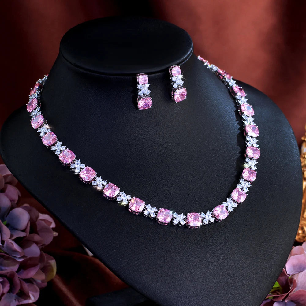 Pink square zirconia necklace and hoop-style drop earrings set on display bust
