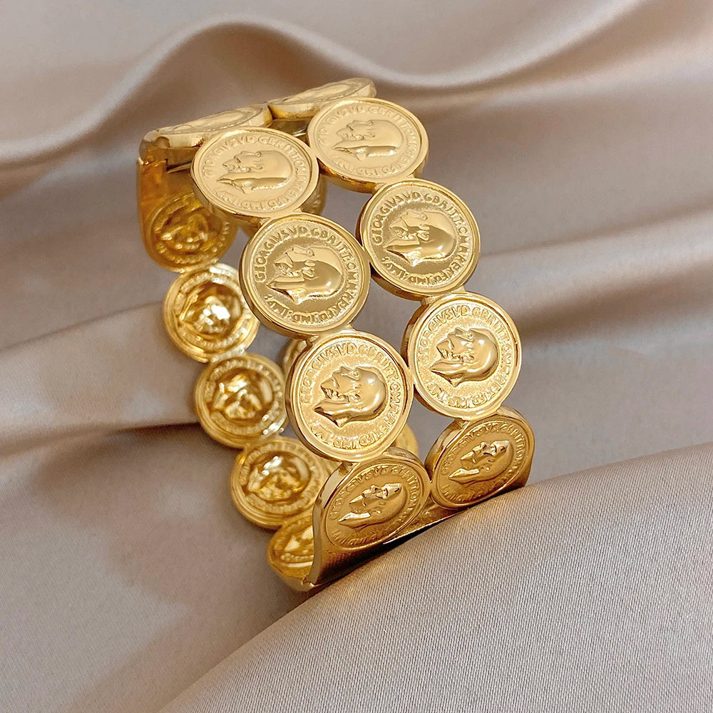Gold plated coin patchwork cuff bangle with human head medallion face details