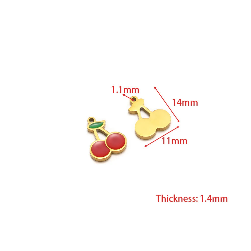 Red cherry charm and yellow fruit charm with enamel accents and gold loop