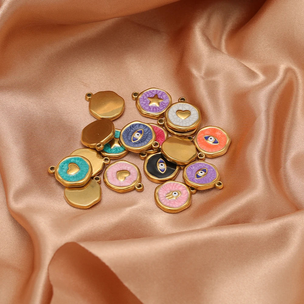 Gold-tone enamel charm lot with evil eye, hearts, and stars, various colors