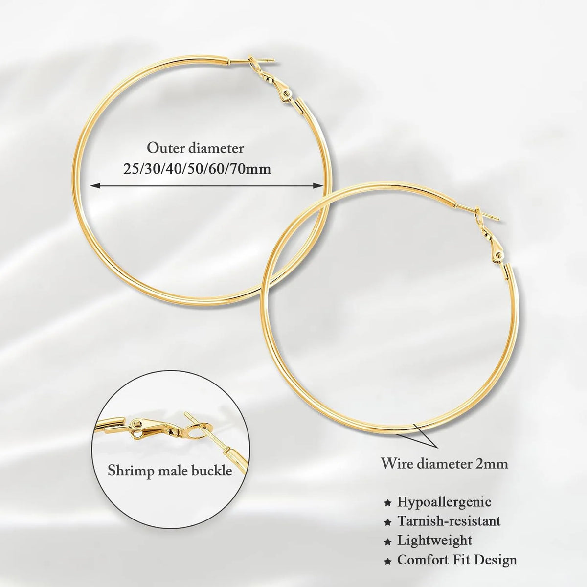 Gold-tone hoop earring detail showing 2 mm wire and hinged clasp.