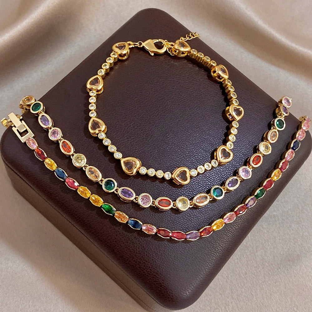 Gold-plated tennis-style bracelet with multicolor oval zircon stones and clasp