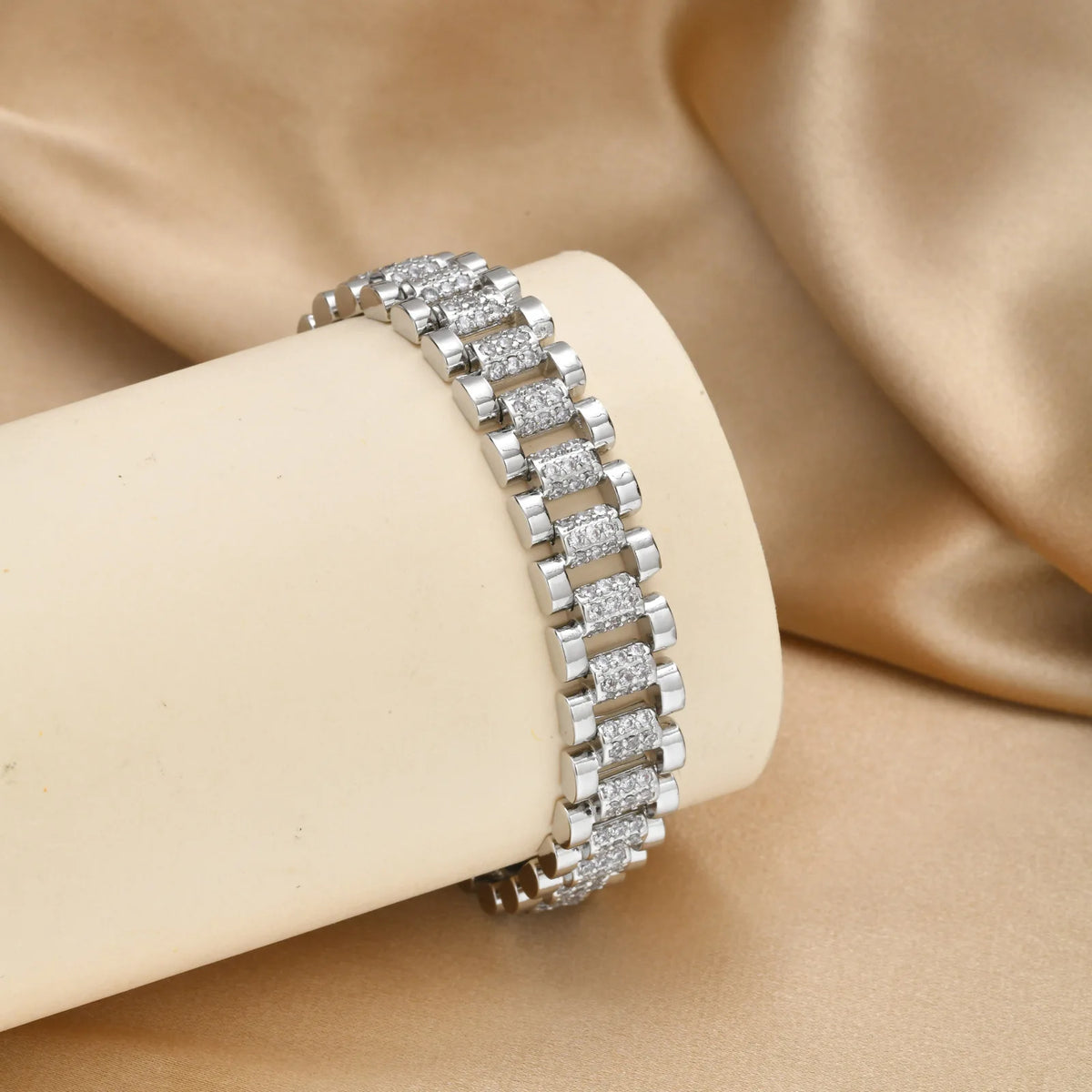 Silver-tone cubic zirconia bracelet stacked on wrist with rectangular row links