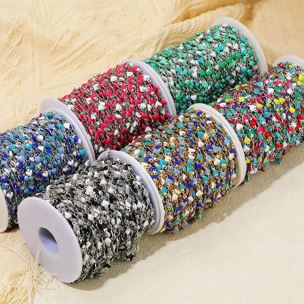 Enamel heart link chains in blue, gold, red and teal on reels, stainless steel