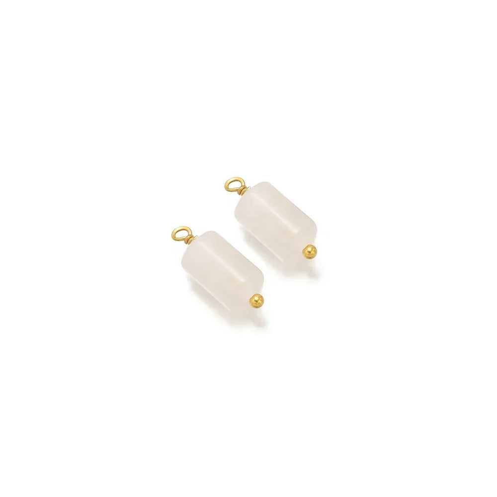 White cylinder stone charms with gold-tone loops