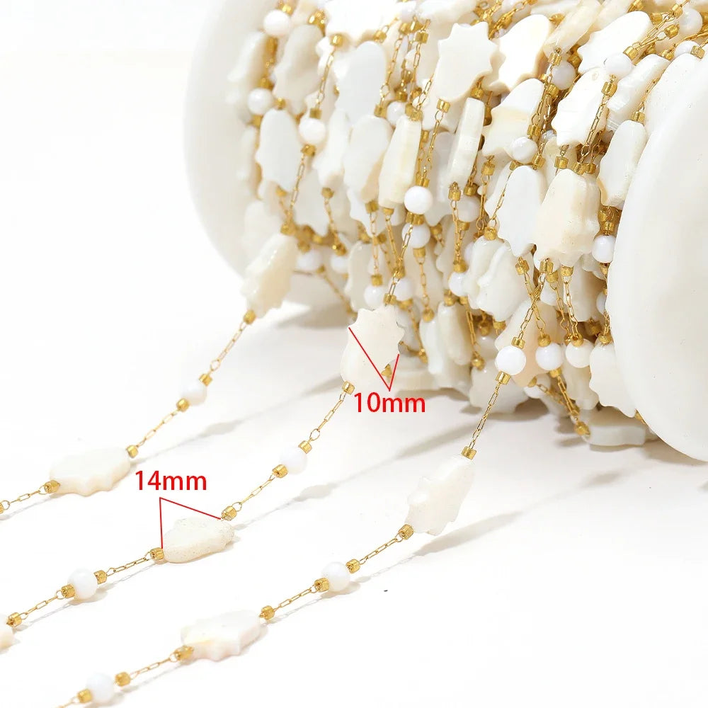 Shell bead chain with white shell drops on gold-tone links (14mm/10mm marked)