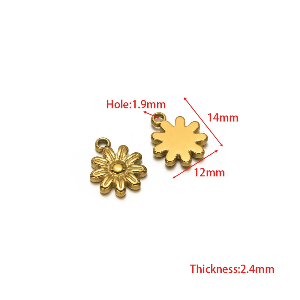 Gold flower and gold snowflake-shaped pendant charms with loop bails