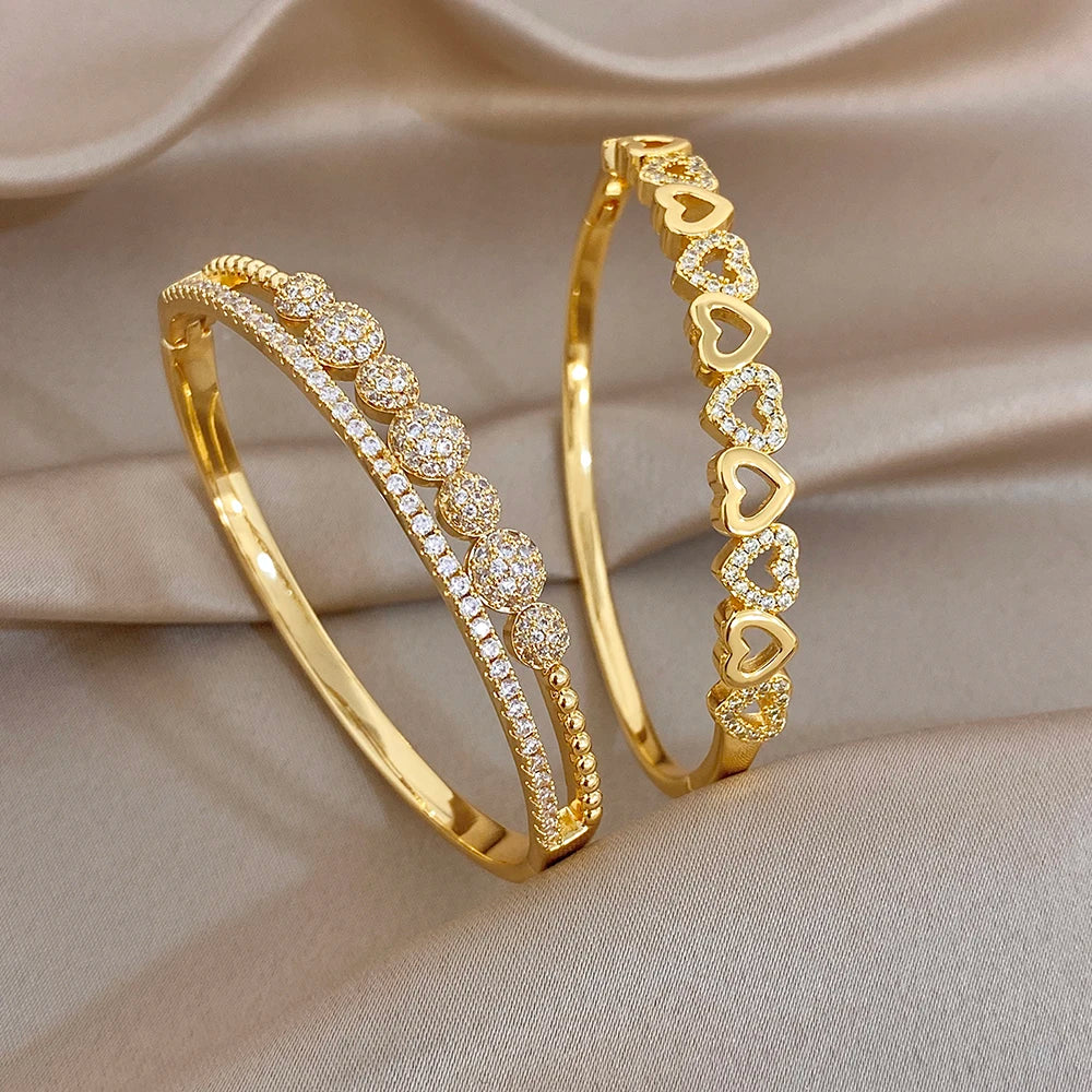 Gold-plated cuff bangle bracelets with heart and zircon accents