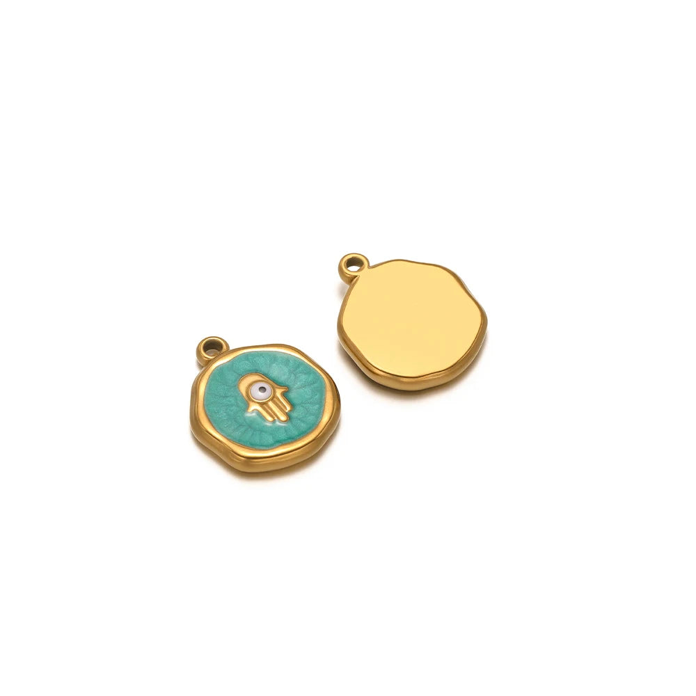 Enamel evil eye charm pendant with teal eye and gold outline on round bezel