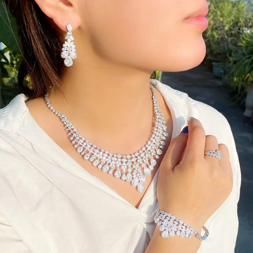 Rhinestone necklace and matching earrings with ring and bracelet on model